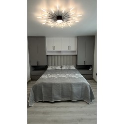Mobilier dormitor modern cu pat tapițat, dulapuri laterale și corpuri suspendate  A-98